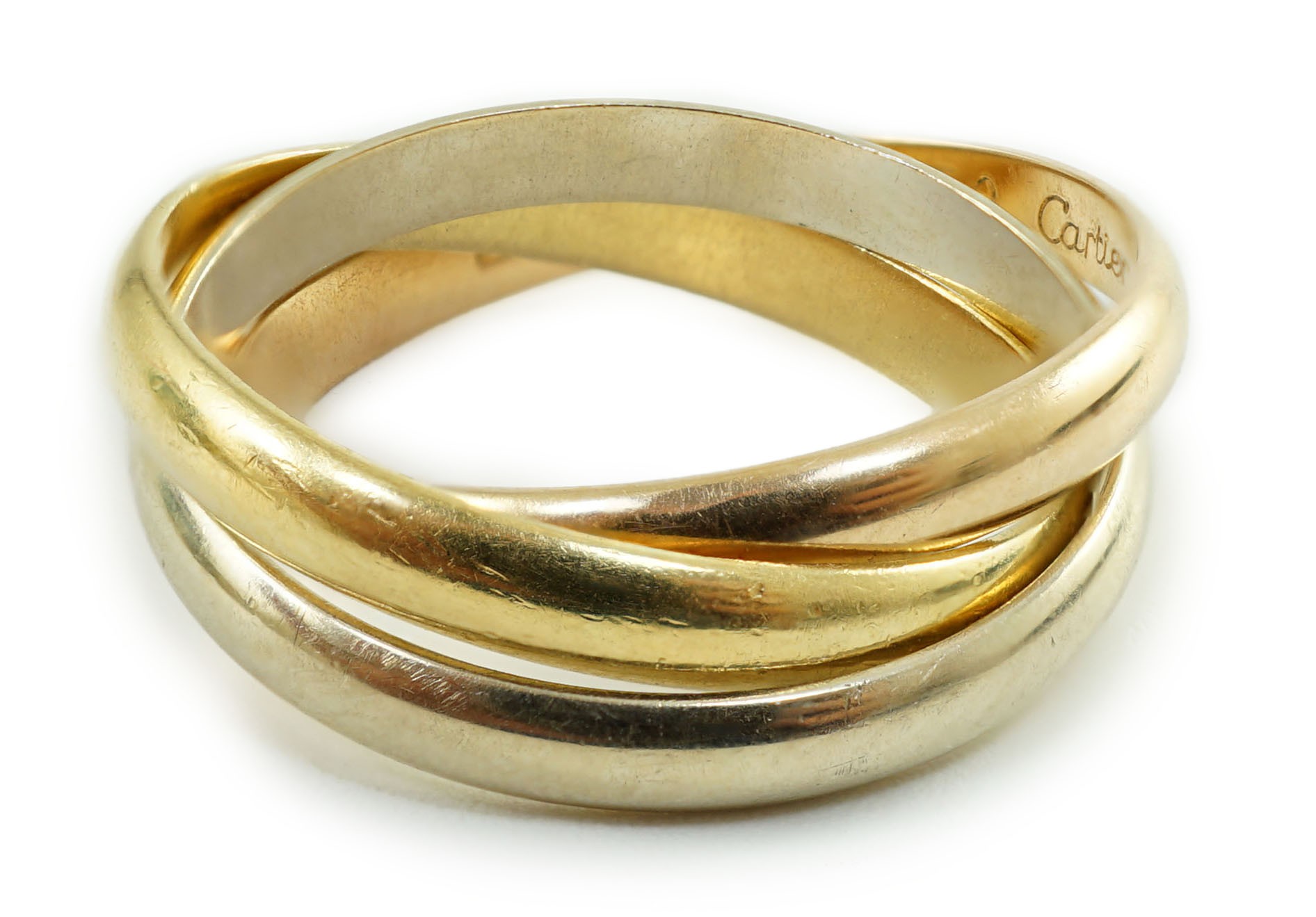 A modern 18ct three colour Cartier 'Russian' triple wedding band